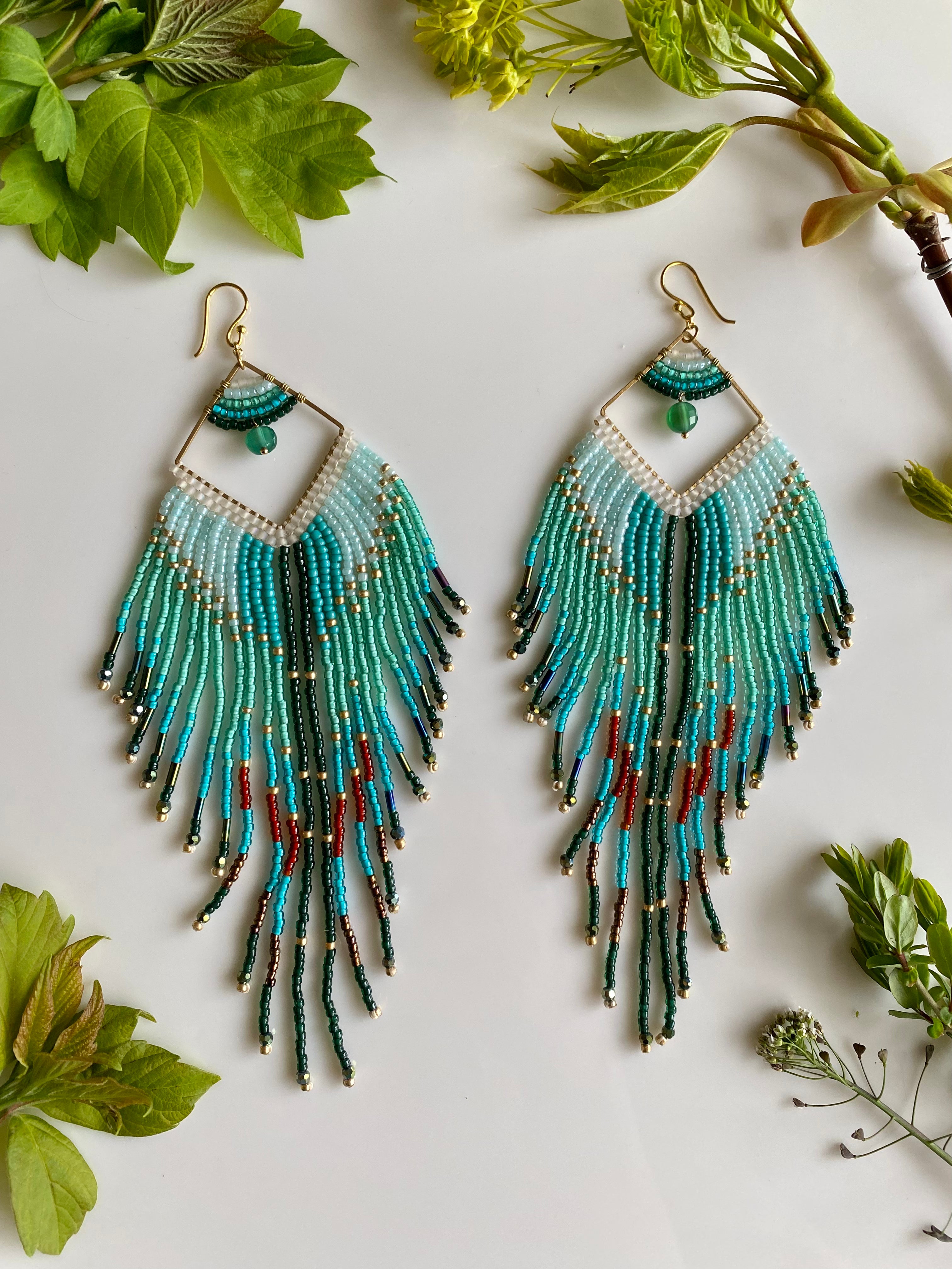 long turquoise beaded earrings with gold accents 